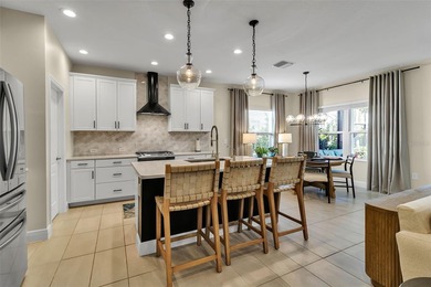 Pool home ~ nestled within the coveted Windward community in the on The Founders Golf Club in Florida - for sale on GolfHomes.com, golf home, golf lot