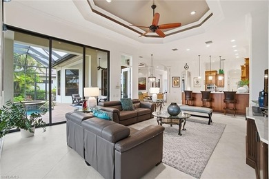 Prepare to experience a residence where timeless craftsmanship on Shadow Wood Preserve in Florida - for sale on GolfHomes.com, golf home, golf lot