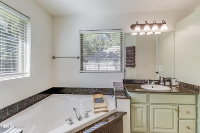 Located in the heart of Diamondhead, this 3-bedroom, 2-bath home on Diamondhead Country Club in Mississippi - for sale on GolfHomes.com, golf home, golf lot