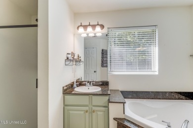 Located in the heart of Diamondhead, this 3-bedroom, 2-bath home on Diamondhead Country Club in Mississippi - for sale on GolfHomes.com, golf home, golf lot