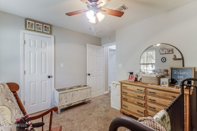 Located in the heart of Diamondhead, this 3-bedroom, 2-bath home on Diamondhead Country Club in Mississippi - for sale on GolfHomes.com, golf home, golf lot