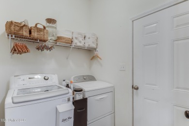 Located in the heart of Diamondhead, this 3-bedroom, 2-bath home on Diamondhead Country Club in Mississippi - for sale on GolfHomes.com, golf home, golf lot