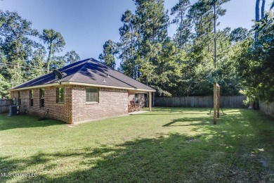 Located in the heart of Diamondhead, this 3-bedroom, 2-bath home on Diamondhead Country Club in Mississippi - for sale on GolfHomes.com, golf home, golf lot