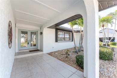 WATERFRONT pool home in Punta Gorda Isles, with intersecting on Saint Andrews South Golf Club in Florida - for sale on GolfHomes.com, golf home, golf lot