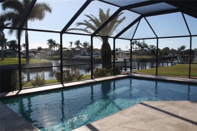 WATERFRONT pool home in Punta Gorda Isles, with intersecting on Saint Andrews South Golf Club in Florida - for sale on GolfHomes.com, golf home, golf lot