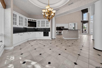 Nestled on a rare, sprawling one-acre, corner lot overlooking on Hollytree Country Club in Texas - for sale on GolfHomes.com, golf home, golf lot