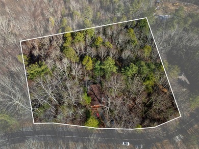 Nestled on 2.3 private wooded acres in the highly sought-after on Connestee Falls Golf Club in North Carolina - for sale on GolfHomes.com, golf home, golf lot