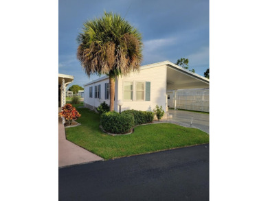 BEAUTIFULLY MAINTAINED 2 BEDROOM 2 BATH HOME IN LILY LAKE, a on Lily Lake Golf and RV Resort in Florida - for sale on GolfHomes.com, golf home, golf lot