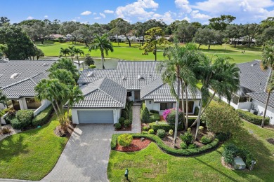 Enjoy golf and water views from this charming one-story on Delray Dunes Golf and Country Club in Florida - for sale on GolfHomes.com, golf home, golf lot