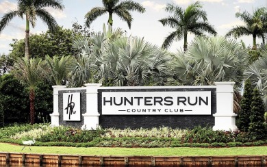 Enjoy golf and water views from this charming one-story on Delray Dunes Golf and Country Club in Florida - for sale on GolfHomes.com, golf home, golf lot