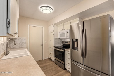 Welcome to 869 Leisure World in Mesa AZ. This 2 bedroom 1.5 bath on Leisure World Country Club in Arizona - for sale on GolfHomes.com, golf home, golf lot