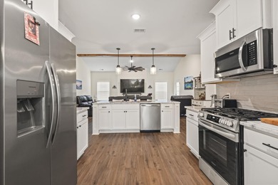 This move-in-ready home features luxury vinyl plank flooring on Shaftesbury Glen Golf and Fish Club in South Carolina - for sale on GolfHomes.com, golf home, golf lot