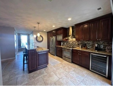 Prepare to be WOW'd! Located in Louisquisett Country Club & Golf on Louisquisset Golf Club in Rhode Island - for sale on GolfHomes.com, golf home, golf lot