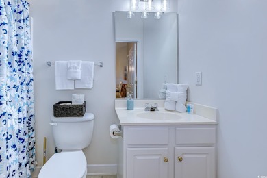 Enjoy easy coastal living in this 2-bedroom, 2-bath condo on Barefoot Resort and Golf Club  in South Carolina - for sale on GolfHomes.com, golf home, golf lot