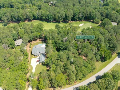 Views along the tranquil 12th green of the prestigious Jack on Great Waters Course At Reynolds Plantation in Georgia - for sale on GolfHomes.com, golf home, golf lot