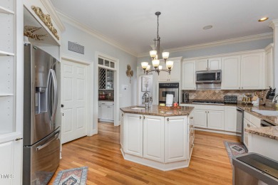 Experience unparalleled luxury and breathtaking views in this on TPC at Wakefield Plantation in North Carolina - for sale on GolfHomes.com, golf home, golf lot