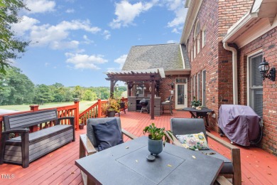 Experience unparalleled luxury and breathtaking views in this on TPC at Wakefield Plantation in North Carolina - for sale on GolfHomes.com, golf home, golf lot