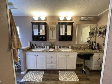 This three-bed, two-bath beauty is spacious and clean with on Four Lakes Golf Club in Florida - for sale on GolfHomes.com, golf home, golf lot