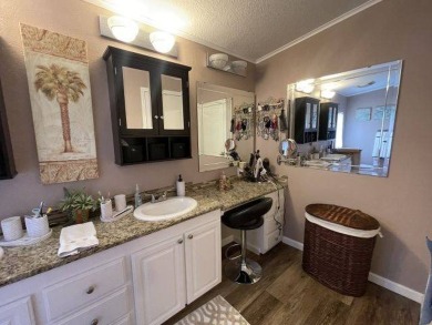 This three-bed, two-bath beauty is spacious and clean with on Four Lakes Golf Club in Florida - for sale on GolfHomes.com, golf home, golf lot