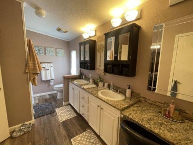 This three-bed, two-bath beauty is spacious and clean with on Four Lakes Golf Club in Florida - for sale on GolfHomes.com, golf home, golf lot