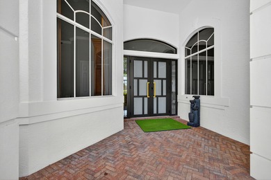 Set on a private cul-de-sac in the boutique Ironhorse community on Ironhorse Country Club in Florida - for sale on GolfHomes.com, golf home, golf lot