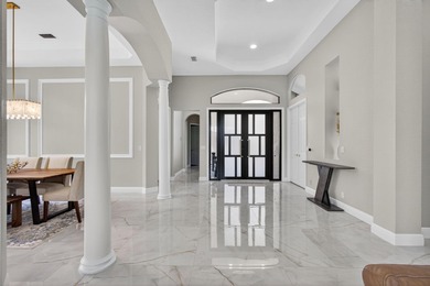 Set on a private cul-de-sac in the boutique Ironhorse community on Ironhorse Country Club in Florida - for sale on GolfHomes.com, golf home, golf lot