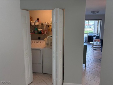 Enjoy Beautiful water and golf views across the 16th and 17th on Legends Golf and Country Club in Florida - for sale on GolfHomes.com, golf home, golf lot