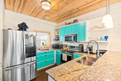 This end-unit, townhouse-style condo is perfectly located near on Palmilla Beach Golf Club in Texas - for sale on GolfHomes.com, golf home, golf lot