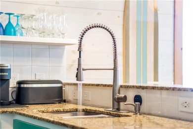 This end-unit, townhouse-style condo is perfectly located near on Palmilla Beach Golf Club in Texas - for sale on GolfHomes.com, golf home, golf lot