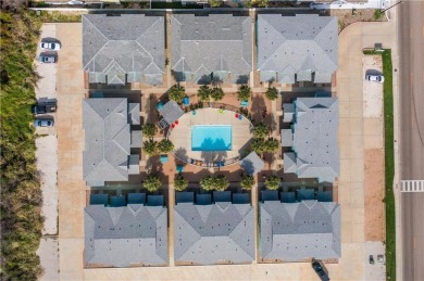 This end-unit, townhouse-style condo is perfectly located near on Palmilla Beach Golf Club in Texas - for sale on GolfHomes.com, golf home, golf lot