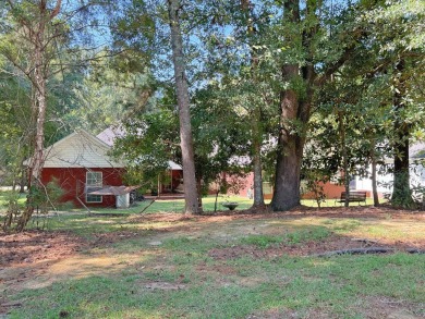 Welcome to your dream home in the serene Olympia Spa subdivision on Dothan National Golf Club and Hotel in Alabama - for sale on GolfHomes.com, golf home, golf lot