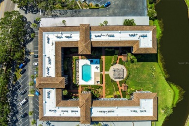 Welcome to this 2-bedroom, 1-bathroom, GROUND-FLOOR condo in on Pasadena Yacht and Country Club in Florida - for sale on GolfHomes.com, golf home, golf lot