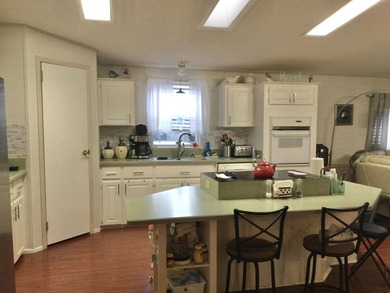 ONE OF THE LARGEST HOMES IN THIS COMMUNITY. THIS 1560 SF HOME IS on Spanish Lakes I in Florida - for sale on GolfHomes.com, golf home, golf lot