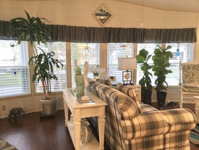 ONE OF THE LARGEST HOMES IN THIS COMMUNITY. THIS 1560 SF HOME IS on Spanish Lakes I in Florida - for sale on GolfHomes.com, golf home, golf lot