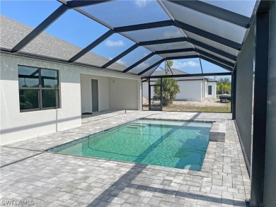 Enjoy the view of the canal and your pool from the lanai in your on Burnt Store Golf Club in Florida - for sale on GolfHomes.com, golf home, golf lot