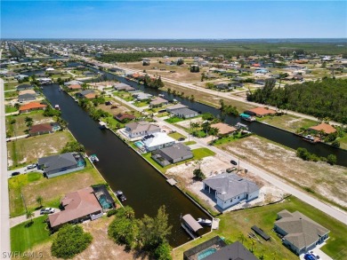 Enjoy the view of the canal and your pool from the lanai in your on Burnt Store Golf Club in Florida - for sale on GolfHomes.com, golf home, golf lot