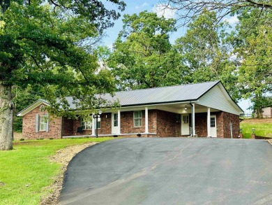 Experience luxury living in this completely remodeled 4-bedroom on Selmer Golf and Country Club in Tennessee - for sale on GolfHomes.com, golf home, golf lot