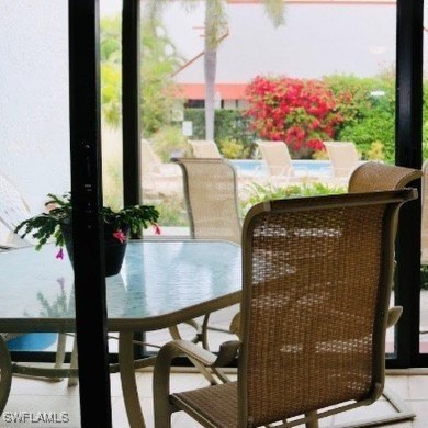 This charming first floor garden-style condominium located in on Club at Pelican Bay Golf Course in Florida - for sale on GolfHomes.com, golf home, golf lot