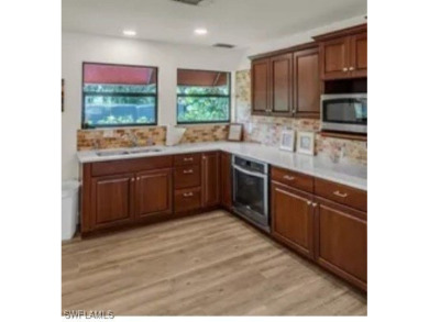 This charming first floor garden-style condominium located in on Club at Pelican Bay Golf Course in Florida - for sale on GolfHomes.com, golf home, golf lot