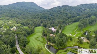 Wake up to crisp mountain air drifting through the windows and on Highlands Country Club in North Carolina - for sale on GolfHomes.com, golf home, golf lot