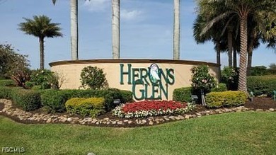 Discover unparalleled Florida living in this beautifully on Herons Glen Golf and Country Club in Florida - for sale on GolfHomes.com, golf home, golf lot