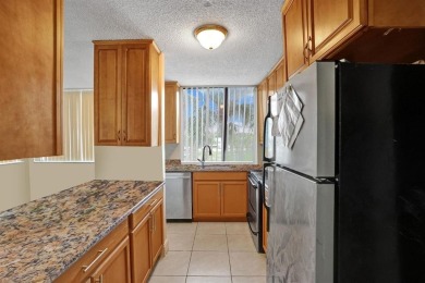 Spacious 2 bed, 2 bath condo with a private balcony and golf on Inverrary Country Club in Florida - for sale on GolfHomes.com, golf home, golf lot