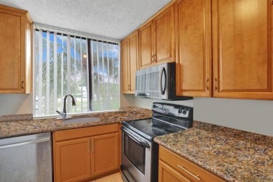 Spacious 2 bed, 2 bath condo with a private balcony and golf on Inverrary Country Club in Florida - for sale on GolfHomes.com, golf home, golf lot