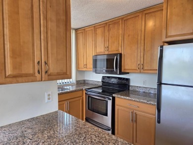 Spacious 2 bed, 2 bath condo with a private balcony and golf on Inverrary Country Club in Florida - for sale on GolfHomes.com, golf home, golf lot
