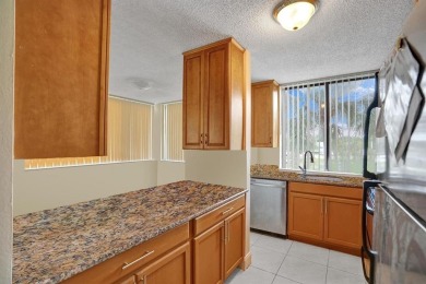 Spacious 2 bed, 2 bath condo with a private balcony and golf on Inverrary Country Club in Florida - for sale on GolfHomes.com, golf home, golf lot