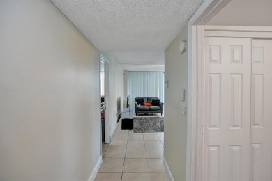 Spacious 2 bed, 2 bath condo with a private balcony and golf on Inverrary Country Club in Florida - for sale on GolfHomes.com, golf home, golf lot