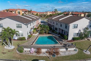STUNNING WATERFRONT TOWNHOME IN PGI W/DEEDED DOCK - Discover the on Saint Andrews South Golf Club in Florida - for sale on GolfHomes.com, golf home, golf lot