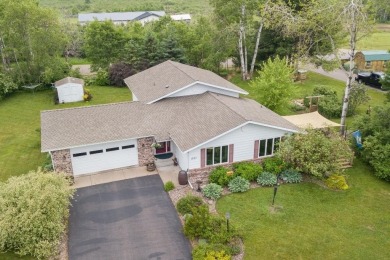 This is a home that checks all the boxes. Inside is a large well on Merrill Golf Club in Wisconsin - for sale on GolfHomes.com, golf home, golf lot