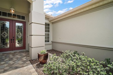This pristine, expanded Hampton shows pride in ownership at on Eagle Ridge At Spruce Creek Country Club in Florida - for sale on GolfHomes.com, golf home, golf lot