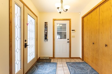This is a home that checks all the boxes. Inside is a large well on Merrill Golf Club in Wisconsin - for sale on GolfHomes.com, golf home, golf lot